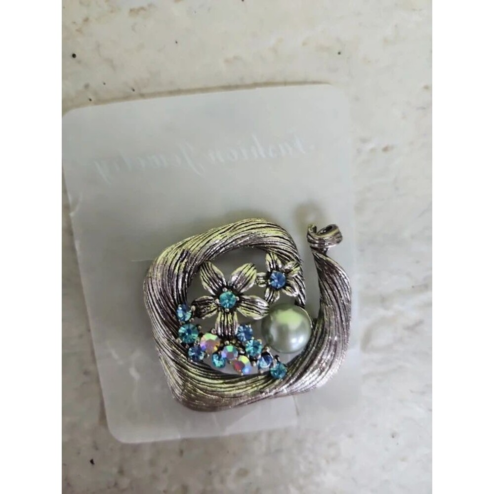 silver and blue crystal flower garden brooch